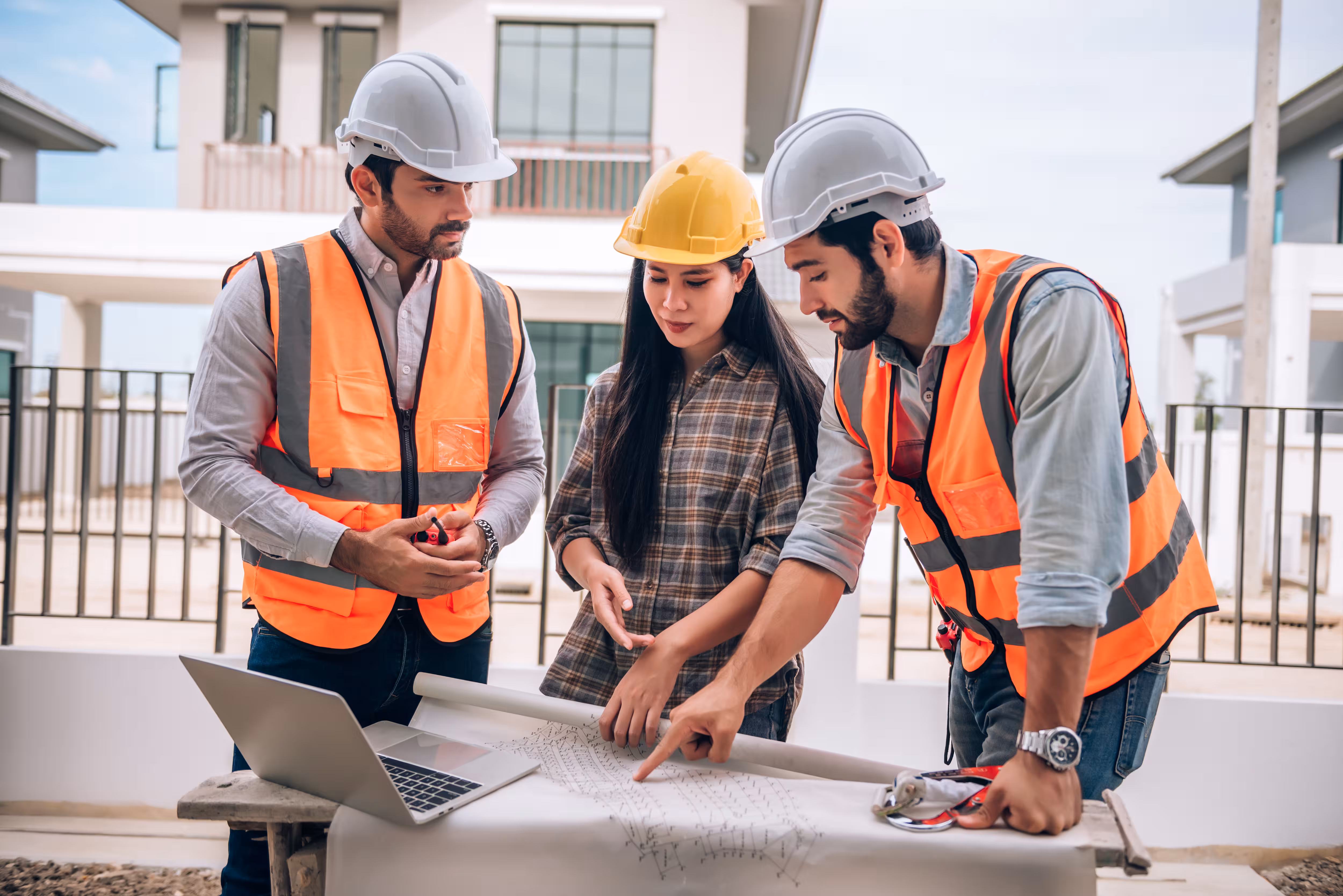 Construction site, drawings in hand